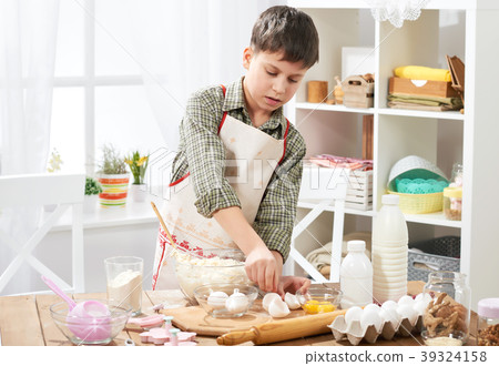 Boy cooking at home, making dough, buns and cookie 39324158