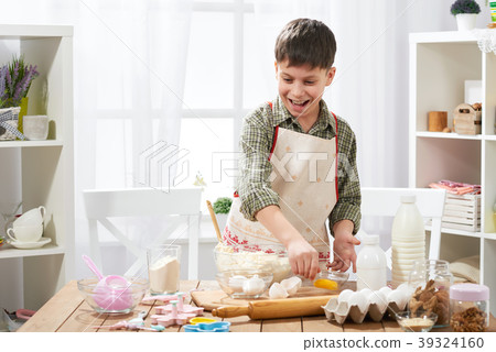 Boy cooking at home, making dough, buns and cookie 39324160