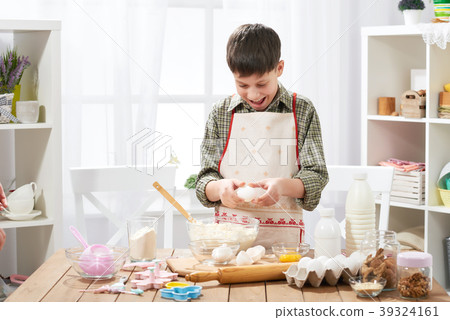 Boy cooking at home, making dough, buns and cookie 39324161