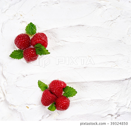 Whipped cream texture decorated with raspberry Whipped cream texture decorated with raspberry 39324850