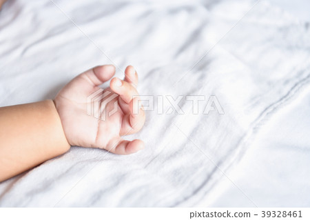 Newborn Concept. Mother and child on a white bed. Mom and baby b 39328461