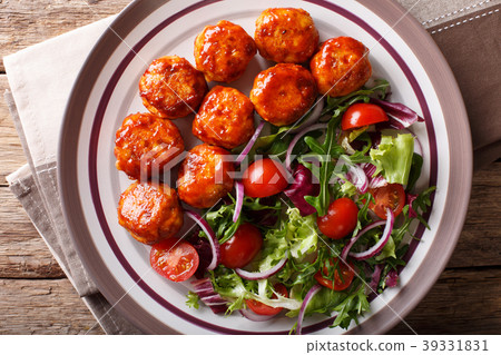 Tasty glazed meatballs with fresh vegetable salad Tasty glazed meatballs with fresh vegetable salad 39331831