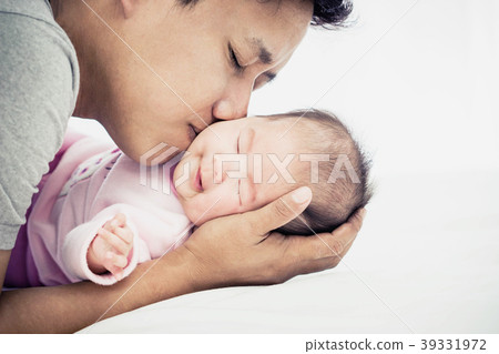 Portrait of happy Father kiss newborn on white background with c 39331972