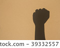 hand shadow fight sign on wall 39332557