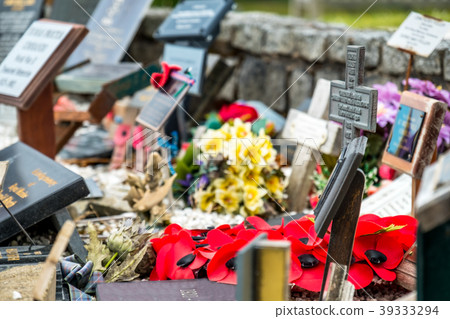Memorial place for the fallen with poppies and Memorial place for the fallen with poppies and 39333294