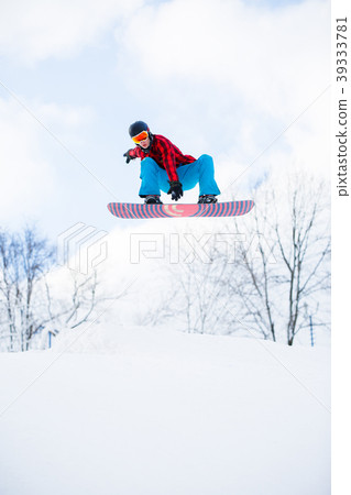 Picture of athlete with snowboard jumping in snowy Picture of athlete with snowboard jumping in snowy 39333781