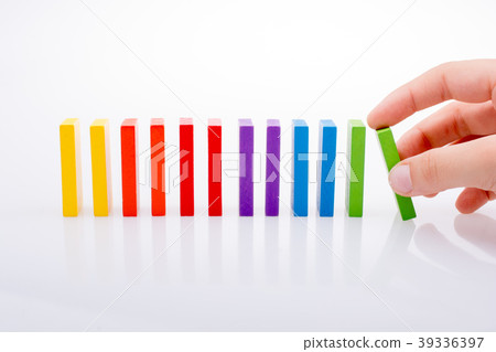 Hand holding color dominoes 39336397