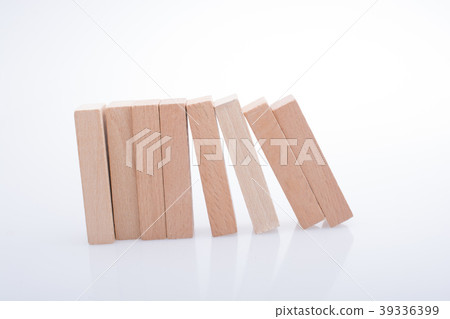 Wooden domino blocks on white background Wooden domino blocks on white background 39336399