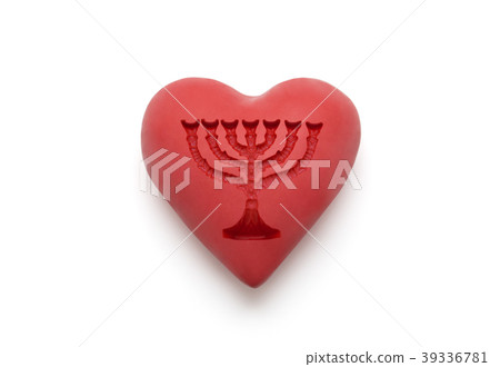 Red heart with imprinted menorah over white 39336781