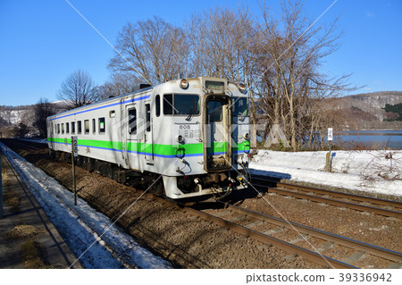 Photographing the scenery of the ordinary train on the JR Hakodate Line, which runs along Lake Onuma in Onuma Quasi-National Park in spring Photographing the scenery of the ordinary train on the JR Hakodate Line, which runs along Lake Onuma in Onuma Quasi-National Park in spring 39336942