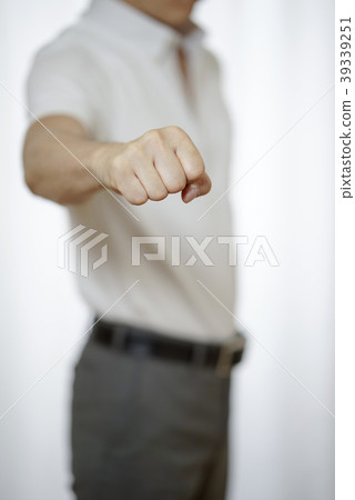 A super cool biz office worker in a polo shirt wearing a guts pose 39339251