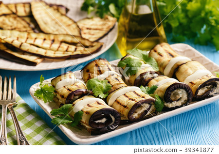 Grilled eggplants rolls with cream cheese, garlic  39341877