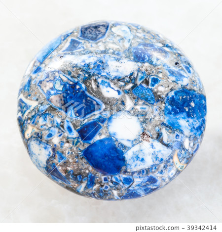 cabochon from pressed Lazurite stone on white 39342414