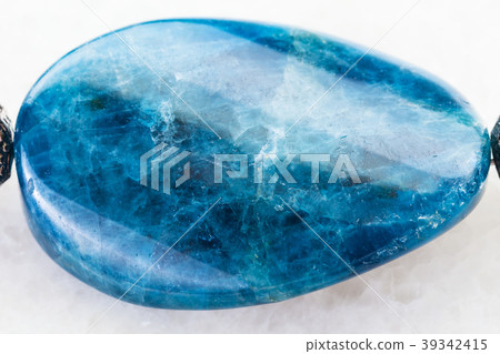 cabochon from Kyanite gemstone on white 39342415