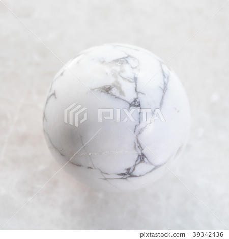 ball from Howlite gemstone on white marble 39342436