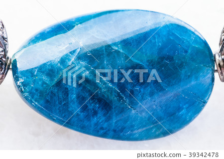 bead from Kyanite gemstone on white 39342478