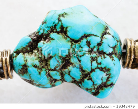 bead from blue howlite gemstone on white 39342479