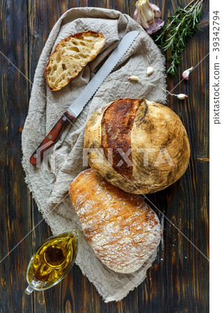 Homemade freshly baked bread on linen cloth. 39342794