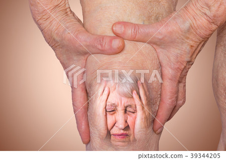 Senior woman holding the knee with pain. Senior woman holding the knee with pain. 39344205