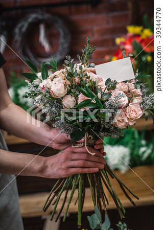 Florist making beautiful bouquet Florist making beautiful bouquet 39344770