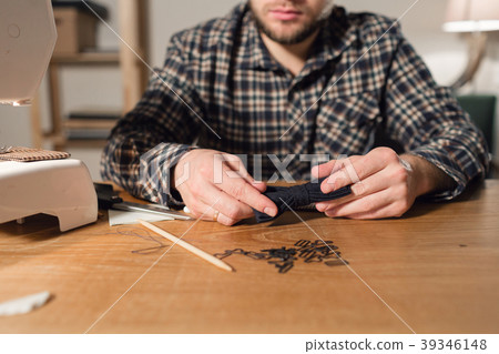 with a needle and thread in hand. Good looking with a needle and thread in hand. Good looking 39346148