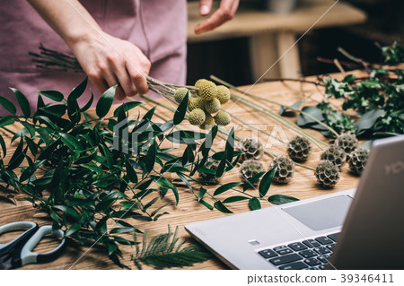 Florist working in modern flower shop Florist working in modern flower shop 39346411