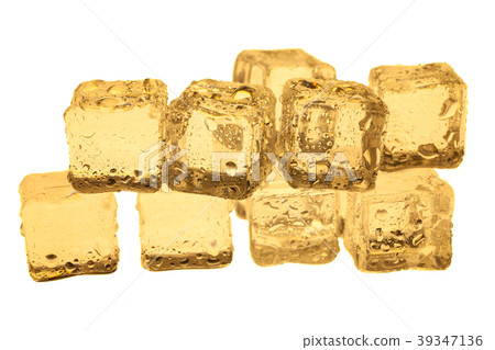 Golden ice cubes on white background. 39347136