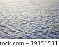 Sky and fluffy clouds taken from airplane window 39351531