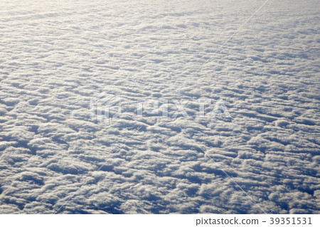 Sky and fluffy clouds taken from airplane window Sky and fluffy clouds taken from airplane window 39351531