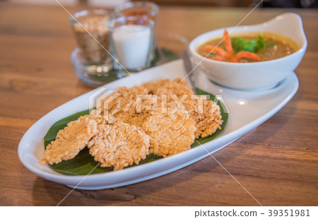 Crispy rice cake and peanut pork sauce. Crispy rice cake and peanut pork sauce. 39351981