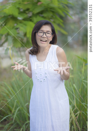 asian woman happiness emotion relaxing in  park 39352131