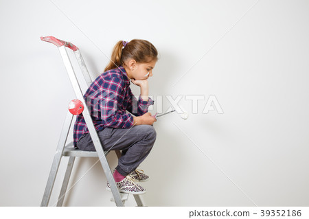 girl on building ladder embarrassed with a brush girl on building ladder embarrassed with a brush 39352186