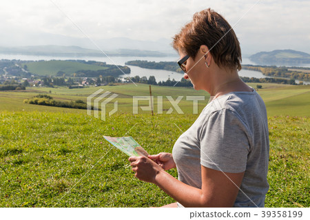 Woman with map on summer hills in Slovakia 39358199