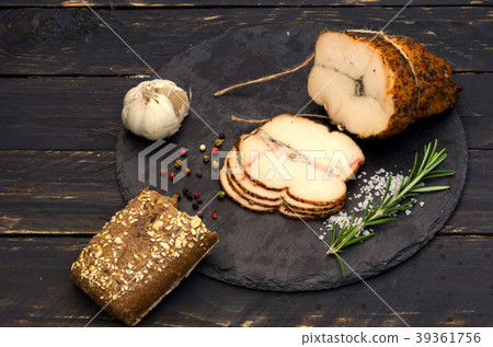 A roll of homemade meat and a slice. A roll of homemade meat and a slice. 39361756