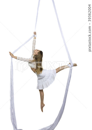 Athletic woman doing some tricks on silks 39362004