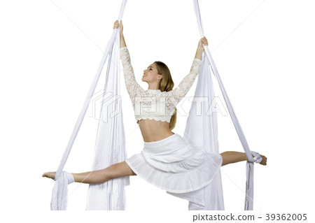 Athletic woman doing some tricks on silks 39362005