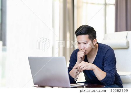 seriously confident asian young freelancer seriously confident asian young freelancer 39362599