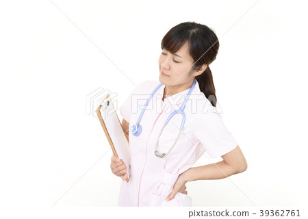 Nurse with tired expression Nurse with tired expression 39362761