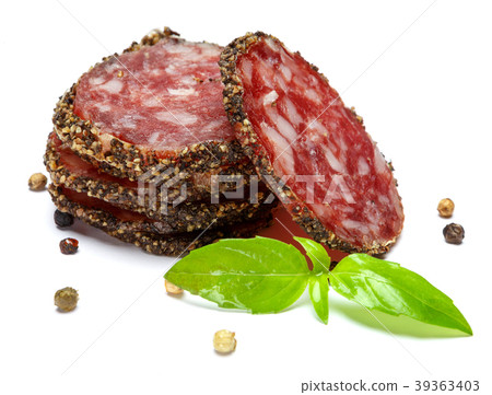 Dried sliced organic salami sausage on white 39363403