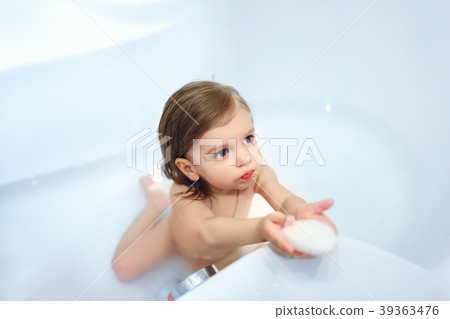 Girl with soap in bath 39363476