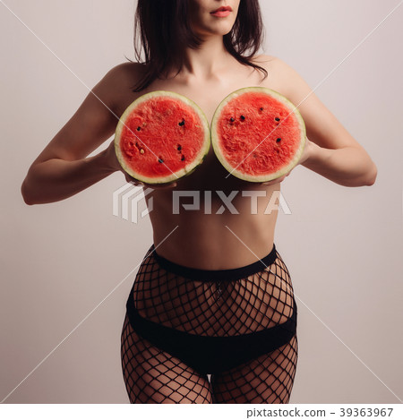 beautiful slender young woman covers her breast  39363967