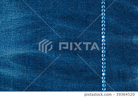 Line of blue rhinestones inlaid on a denim fabric. Line of blue rhinestones inlaid on a denim fabric. 39364520
