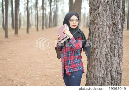 Portrait of happy young muslim woman black hijab  39368049