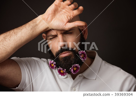 Portrait of tired unshaven man with beard and Portrait of tired unshaven man with beard and 39369304