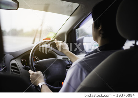 man driving car from rear view on the highway. man driving car from rear view on the highway. 39370094