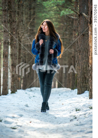 Young hipster woman in winter forest having fun Young hipster woman in winter forest having fun 39370848