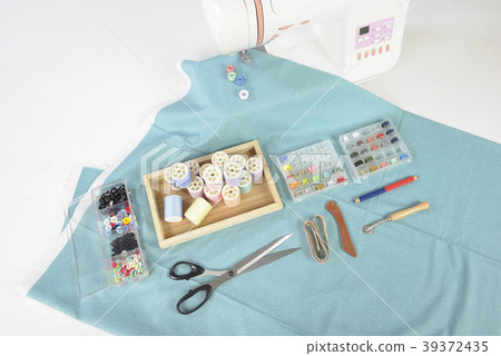 Sewing machine and colorful thread rolls. Sewing machine and colorful thread rolls. 39372435