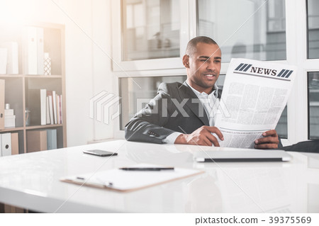 Young handsome man resting with journal Young handsome man resting with journal 39375569
