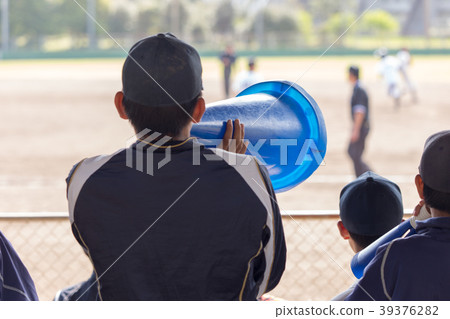 Cheering a boy softball tournament with a megaphone Cheering a boy softball tournament with a megaphone 39376282