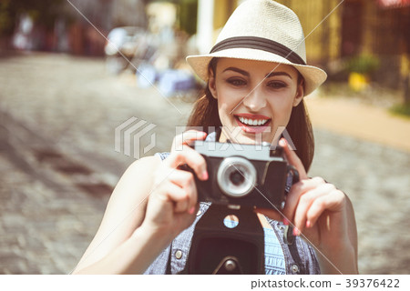 Outgoing woman doing images by camera Outgoing woman doing images by camera 39376422